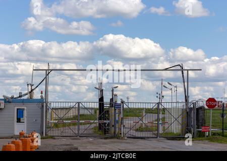 Gate and barrier of the checkpoint with a stop sign. Stock Photo