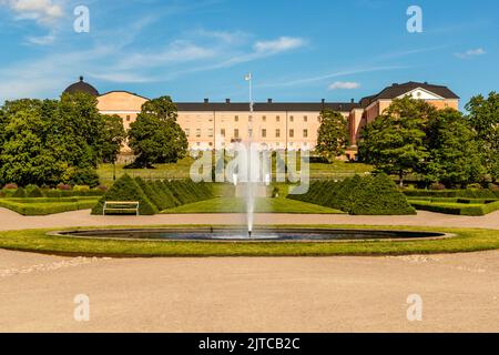 Uppsala Castle rises above Uppsala University's Botanical Garden (Botaniska trädgården) and its fountain, at the foot of the castle hill in Uppsala, Sweden. King Gustav Vasa had the castle built from 1549 on the esker Kasåsen, after crushing the Dacke rebellion. A major fire destroyed large parts of Uppsala in 1702 and severely damaged the castle's south wing. Today the castle is the official seat of the County Governor of Uppsala. Its south wing has housed the Uppsala Art Museum since 1995. The Botanical Garden below the castle was founded in 1655. It moved to this site in 1787, after an 1702 Stock Photo