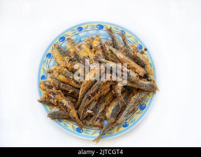 fried sardines and anchovy in white background Stock Photo