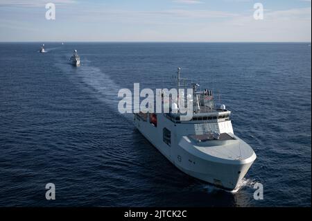 Royal Canadian Navy HMCS Margaret Brooke leads the naval convoy for a photo exercise (PHOTOEX) in the Northern Atlantic Ocean, Aug. 6, 2022. USCGC Bear (WMEC 901) was one of many multi-national vessels that were also in this formation. (U.S. Coast Guard photo by Petty Officer 3rd Class Matthew Abban) Stock Photo