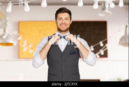 happy man in festive suit dressing for party Stock Photo