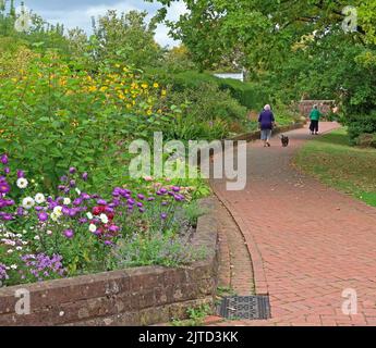 Paths, walkers, Grappenhall Walled Garden, Grappenhall Heys, Warrington, Cheshire, England, UK Stock Photo