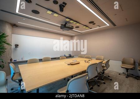 Contemporary office meeting room with a projection screen Stock Photo