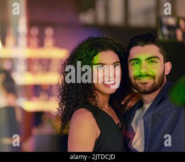 Let the good times roll. a young couple enjoying themselves at a nightclub. Stock Photo