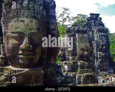 Giant stone faces at Cambodian temple complex Stock Photo