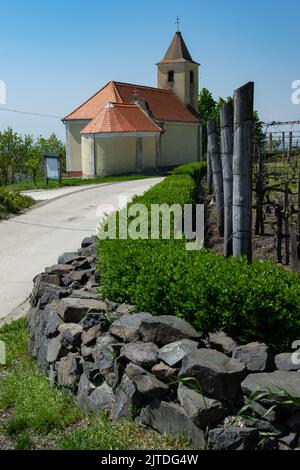 Rural village church in vineyard area Stock Photo