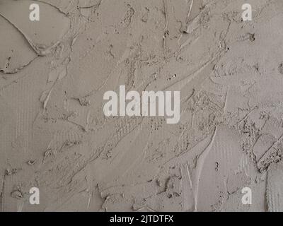 Plastering cement on a reinforcing plastic grid on a foam board Stock Photo