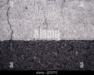 Close-up the cracked on the surface of Road Line painted Stock Photo