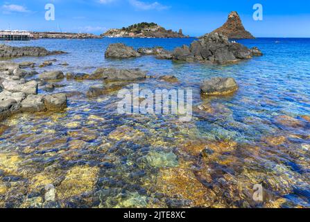 Cyclopean Isles, Aci Trezza, Sicily, Italy. These were the great stones thrown at Odysseus by the monster Cyclops in the epic poem 'The Odyssey.' Stock Photo