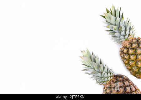 Two whole pineapples isolated on white background Stock Photo