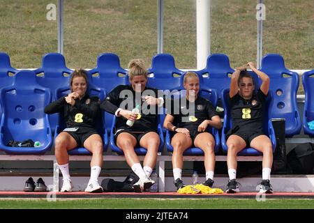 England's Rachel Daly, Millie Bright, Beth Mead and Ella Toone in the dugouts during a training session at St. George's Park, Burton-on-Trent. Picture date: Tuesday August 30, 2022. Stock Photo