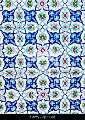 traditional Uzbek pattern on ceramic tile on wall of mosque Seamless old floral pattern Abstract background. Stock Photo