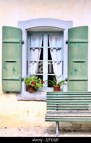 french style windows with green shutters Stock Photo