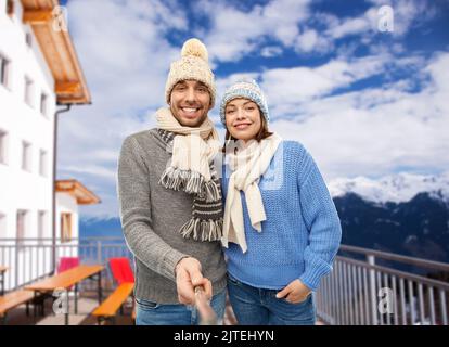 happy couple taking selfie in winter Stock Photo