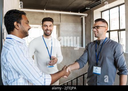 happy businessmen making handshake at office Stock Photo