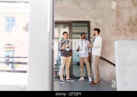 businessmen drinking coffee and water at office Stock Photo