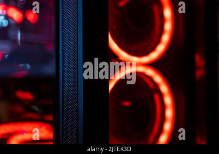 Colorful bright led rgb pc fan air case cooler in white desktop computer chassis. gaming modding water cooling and technology concept background Stock Photo