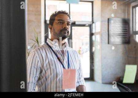 man working at office with charts on glass board Stock Photo