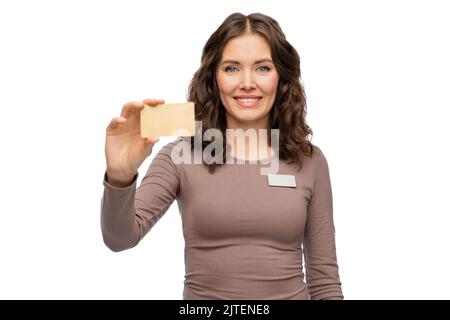 happy female shop assistant with credit card Stock Photo