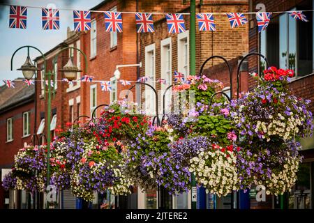 Railway town Crewe, Cheshire East. floral displays and flags int he town centre Stock Photo