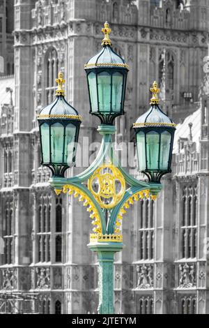 Close up of a lampost on Westminster bridge, the houses of Parliament in the background. Black and white photography with selective color Stock Photo