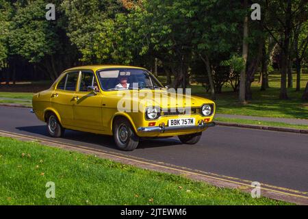 1973 70s seventies Yellow FORD 1098cc petrol; Cars arriving at the annual Stanley Park Classic Car Show. Stanley Park Classics Yesteryear Motor Show is hosted by Blackpool Vintage Vehicle Preservation Group, UK. Stock Photo