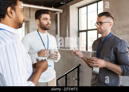 businessmen drinking coffee and water at office Stock Photo