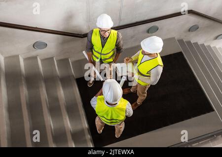 architects in helmets working at office Stock Photo