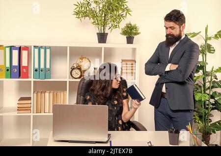 Work task order. Boss set task to secretary. Office work. Man and woman at workplace Stock Photo