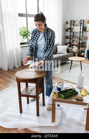 woman applying solvent to rag at home Stock Photo - Alamy