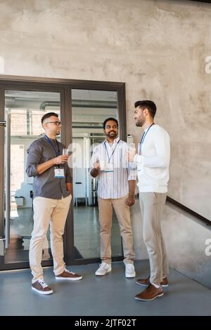 businessmen drinking coffee and water at office Stock Photo