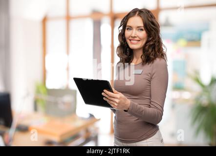 happy woman with tablet pc at office Stock Photo