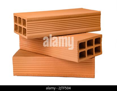 bricks piled up isolated on white background Stock Photo