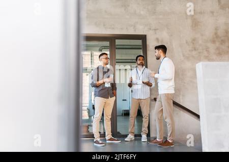 businessmen drinking coffee and water at office Stock Photo