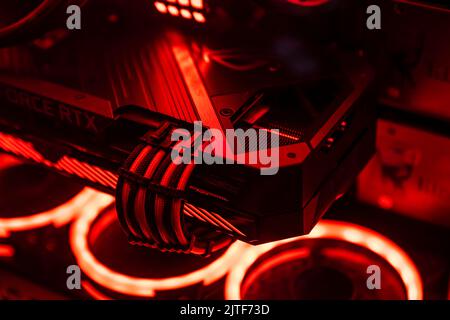 Milan, Italy 30 august 2022: A graphics card with a futuristic design. Powerful gaming graphics card for video games and cryptocurrency mining. Dark k Stock Photo
