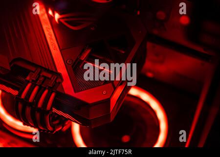 Milan, Italy 30 august 2022: A graphics card with a futuristic design. Powerful gaming graphics card for video games and cryptocurrency mining. Dark k Stock Photo