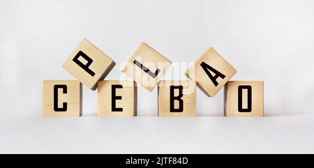 The word PLACEBO written in wooden cubes on a white table Stock Photo