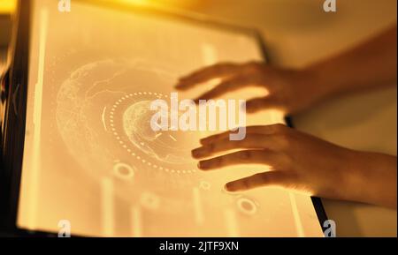hands on led light tablet at night office Stock Photo