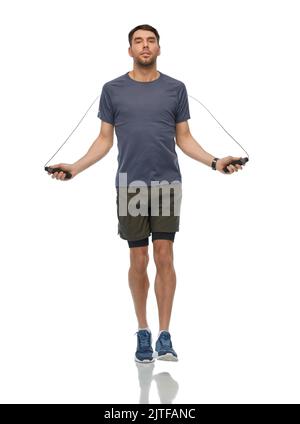 man exercising with jump rope Stock Photo