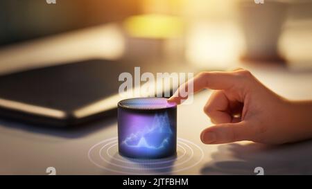 close up of hand with smart speaker at office Stock Photo
