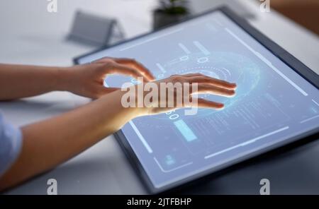 hands on led light tablet at office Stock Photo