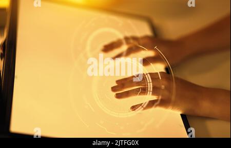 hands on led light tablet at night office Stock Photo