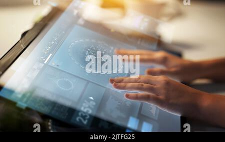 hands on led light tablet at night office Stock Photo