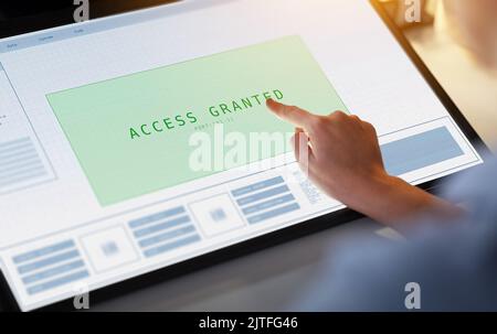 hand on led light tablet at night office Stock Photo