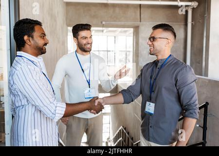happy businessmen making handshake at office Stock Photo