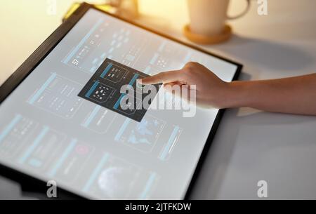 hand on led light tablet at night office Stock Photo