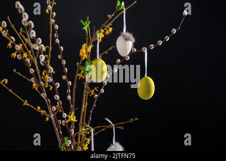 willow and forsythia branches with easter eggs Stock Photo