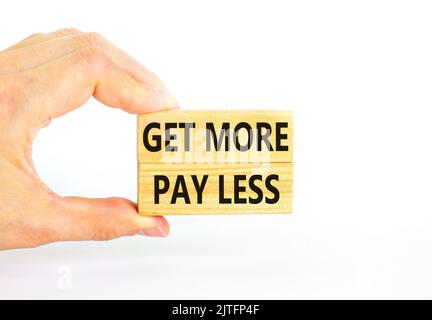 Get more pay less symbol. Concept words Get more pay less on wooden blocks on a beautiful white table white background. Businessman hand. Business Get Stock Photo