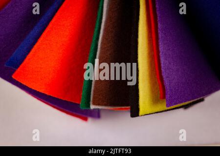Several colored felt texture background. Assorted color felt fabric sheets, patchwork, sewing DIY craft Stock Photo