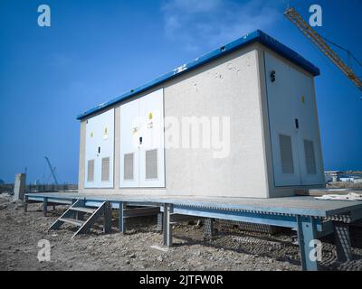 Electric transformer substation at construction site Stock Photo